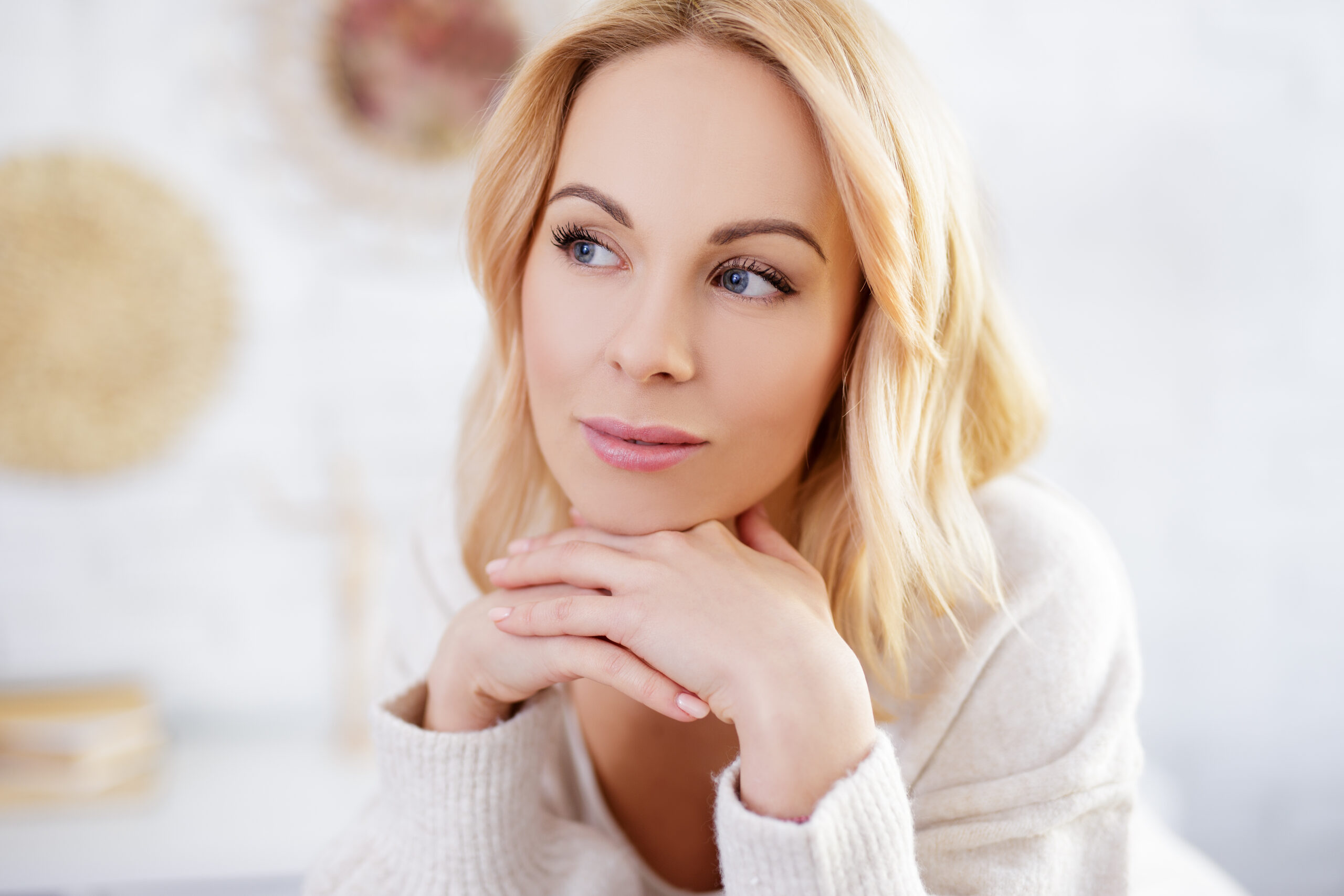 a blonde woman thinking